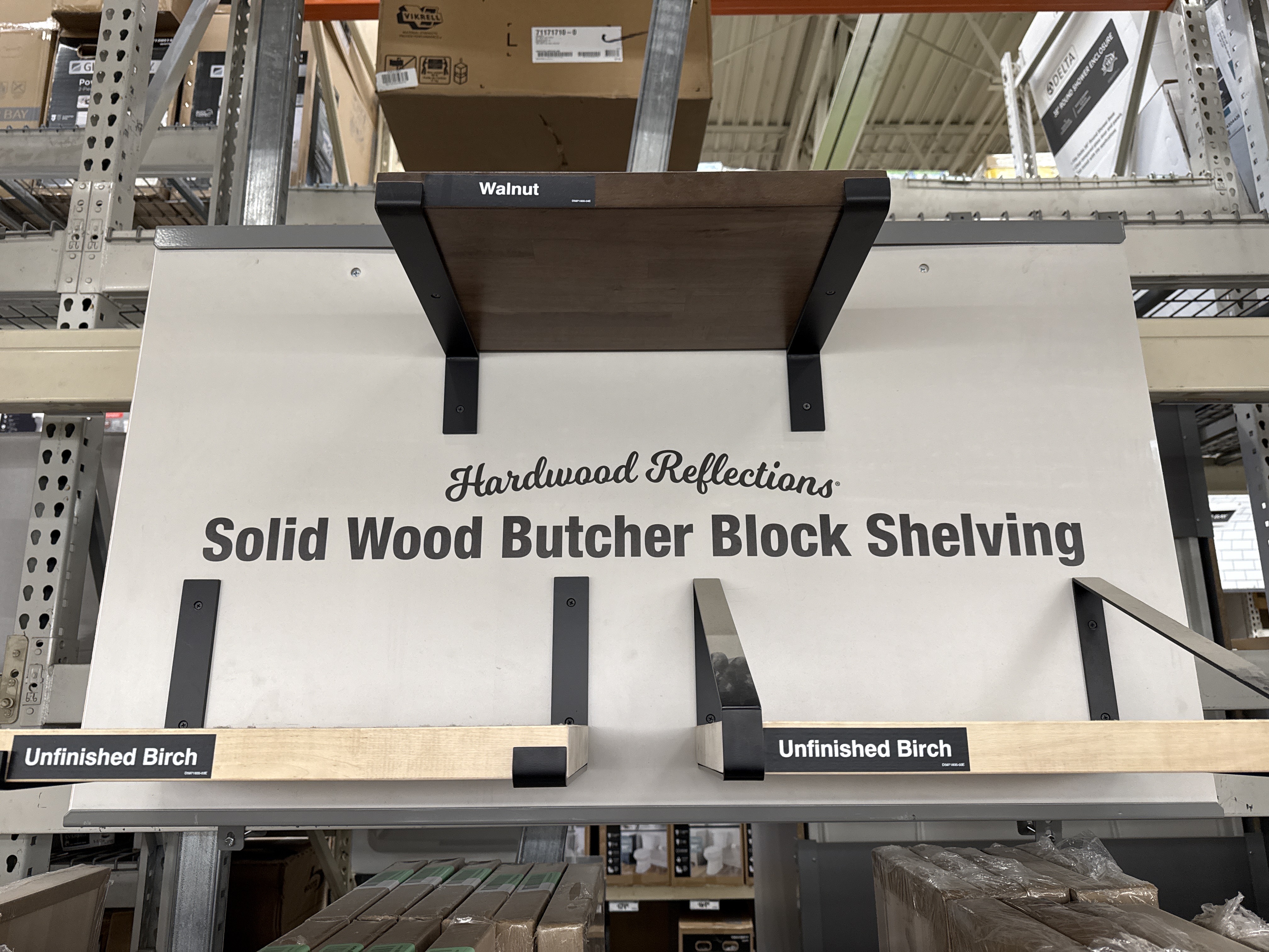 Browsing solid wood shelving at Home Depot — beautiful, but over $300 for what I needed.
